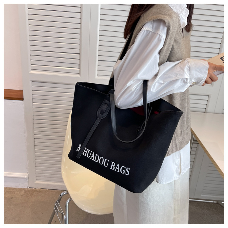 Canvas Große Damen 2023 Neue Mode Pendler Umhängetasche Einfarbig Brief Stil Urban Einfache Einkaufstasche_voghion.com