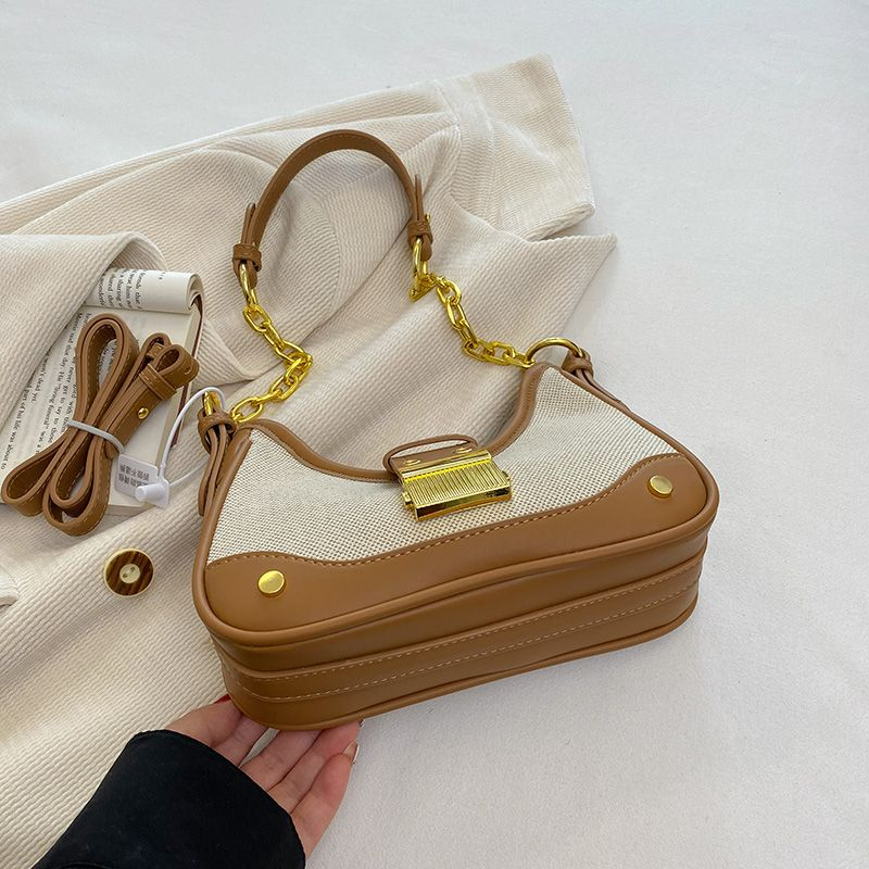 2023 Uusi niche-muotoinen ketjumainen crossbody-naisten muotilaukku, jossa on yksi olkapää ja kainalo._voghion.com