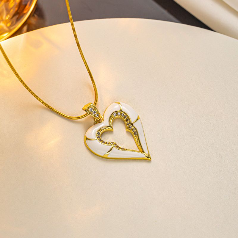 Collana con catena a serpente in acciaio al titanio placcato oro vero, in smalto, con goccia di olio e diamanti intarsiati, temperamento, amore_voghion.com