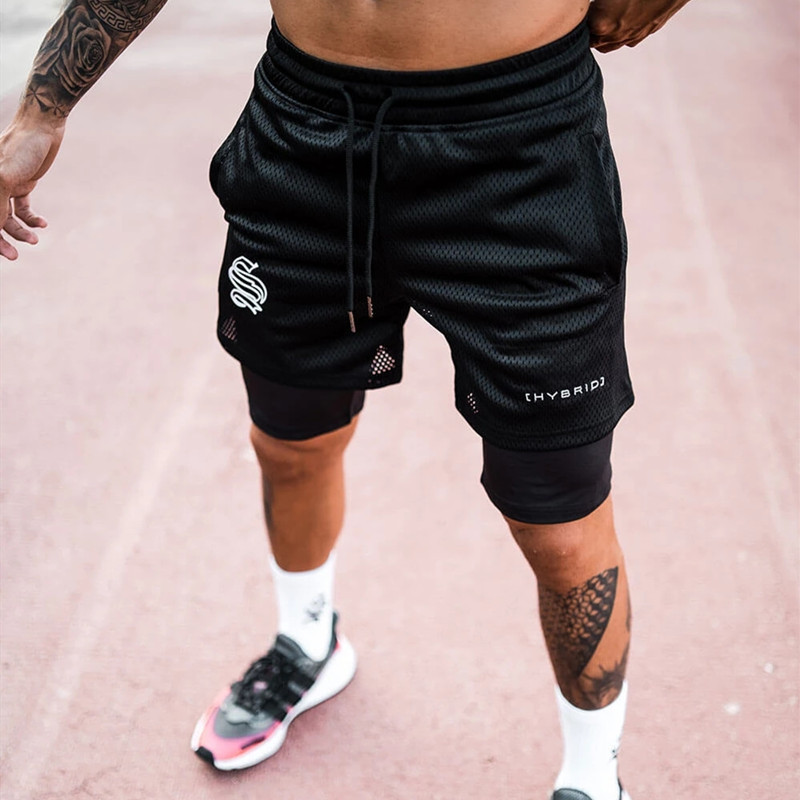 Pantaloncini sportivi alla moda a doppio strato per l'allenamento da uomo falso in due pezzi da basket in esecuzione fitness capris_voghion.com