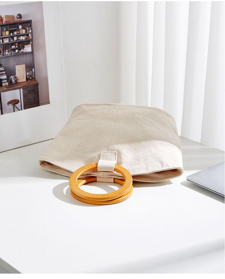 Borsa versatile e di grande capienza in versione coreana, la nuova borsa da donna minimalista in tela di quest'anno, manico in legno_voghion.com