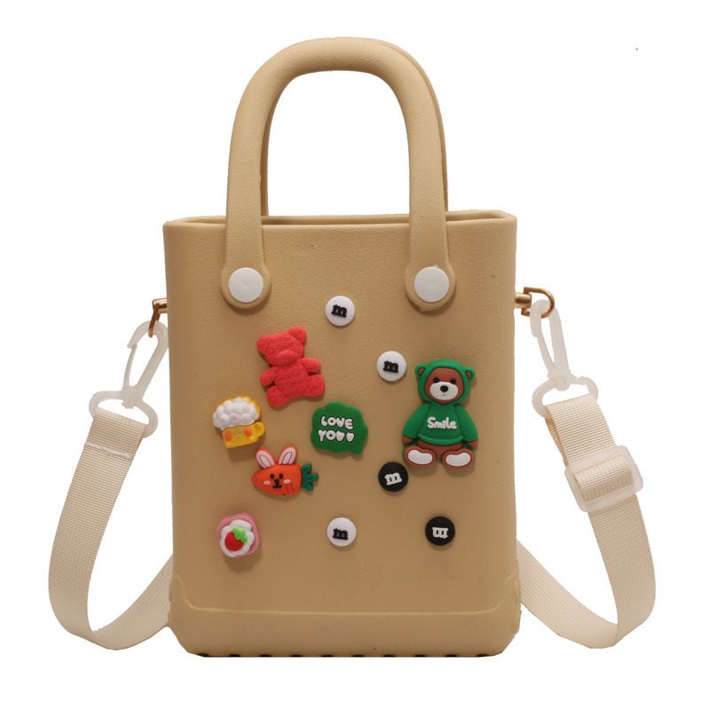 2025 Nuovo design di nicchia Elegante foro Cartone animato Carino secchiello portatile Versatile borsa a tracolla in gelatina_voghion.com