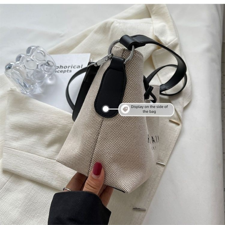 Design de nicho da moda deste ano 2025 Novas bolsas femininas casuais versáteis de lona crossbody de mão_voghion.com