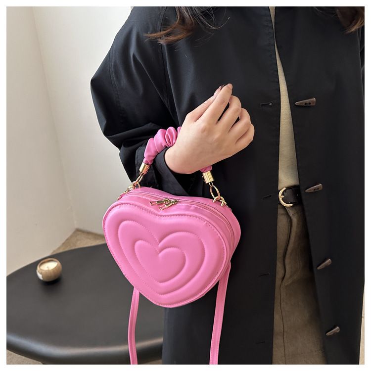 Indentatura semplice a forma di cuore carina tinta unita femminile cuore shopping moda plissettata borsa a tracolla_voghion.com