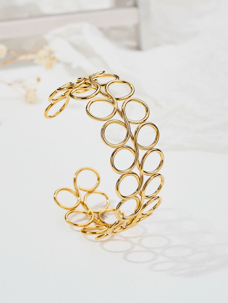 Bracelet en acier inoxydable creux simple en métal avec décoration à la main personnalisée en titane_voghion.com