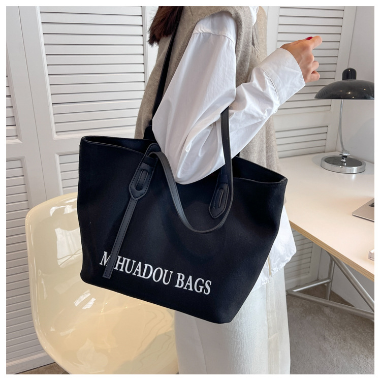 Canvas Große Damen 2023 Neue Mode Pendler Umhängetasche Einfarbig Brief Stil Urban Einfache Einkaufstasche_voghion.com