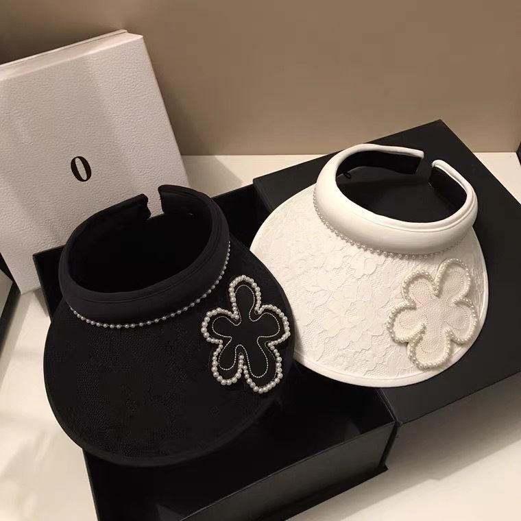 Top vuoto in stile forcina in pizzo jacquard coreano per viaggi estivi, parasole leggero con fiori di perle che riduce l'età e sole_voghion.com