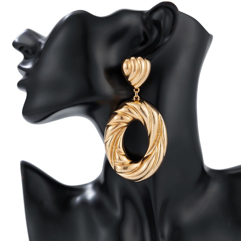 Personality metal geometric texture hollow earrings female irregular twisted glossy earrings earrings_voghion.com