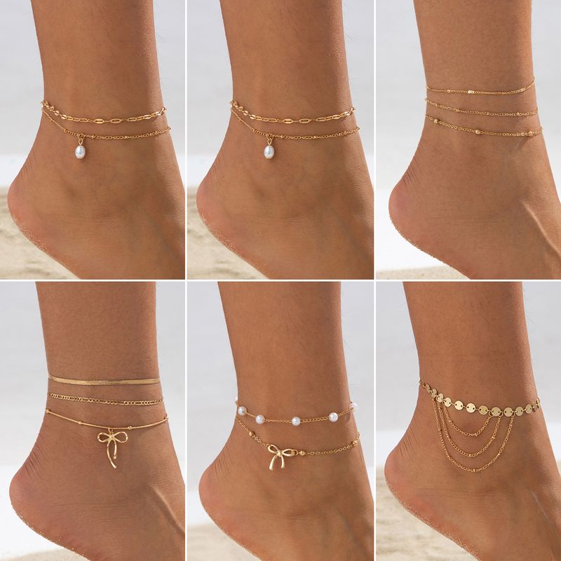 Corrente de pé boêmia étnica retrô para mulheres, corrente de pé com pingente de laço simples, estilo praia e férias, joias para pés empilhados com corrente fina de pérolas_voghion.com