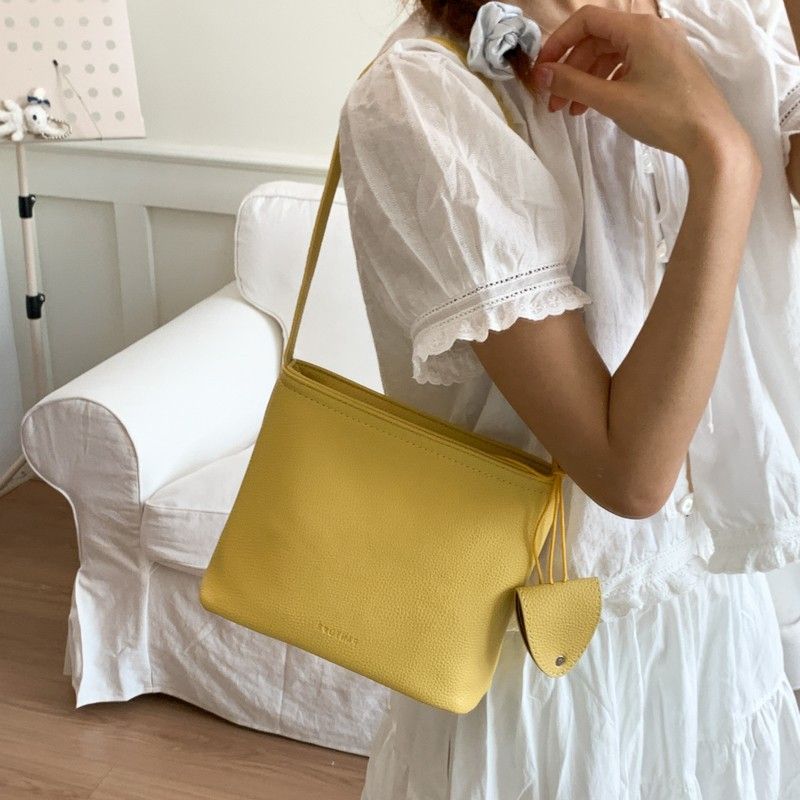 Borsa a secchiello semplice da portare a mano in stile coreano per le donne 2025, nuova nicchia versatile casual, trama litchi, spalla singola_voghion.com