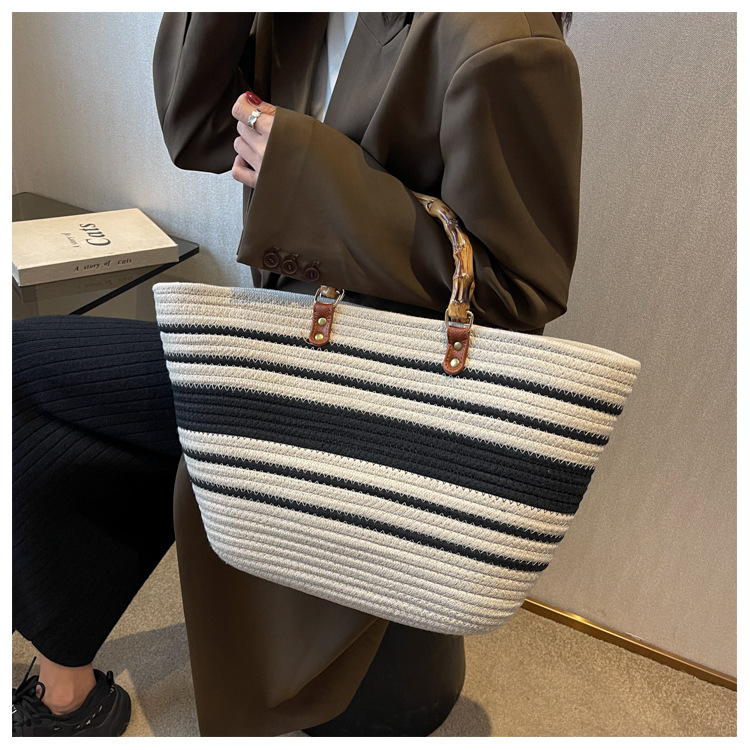 Temperament und gewebte Damen 2024 Neue Mode Tote Gespleißt Eine Schulter Große Kapazität Bambus Knoten Handtasche_voghion.com