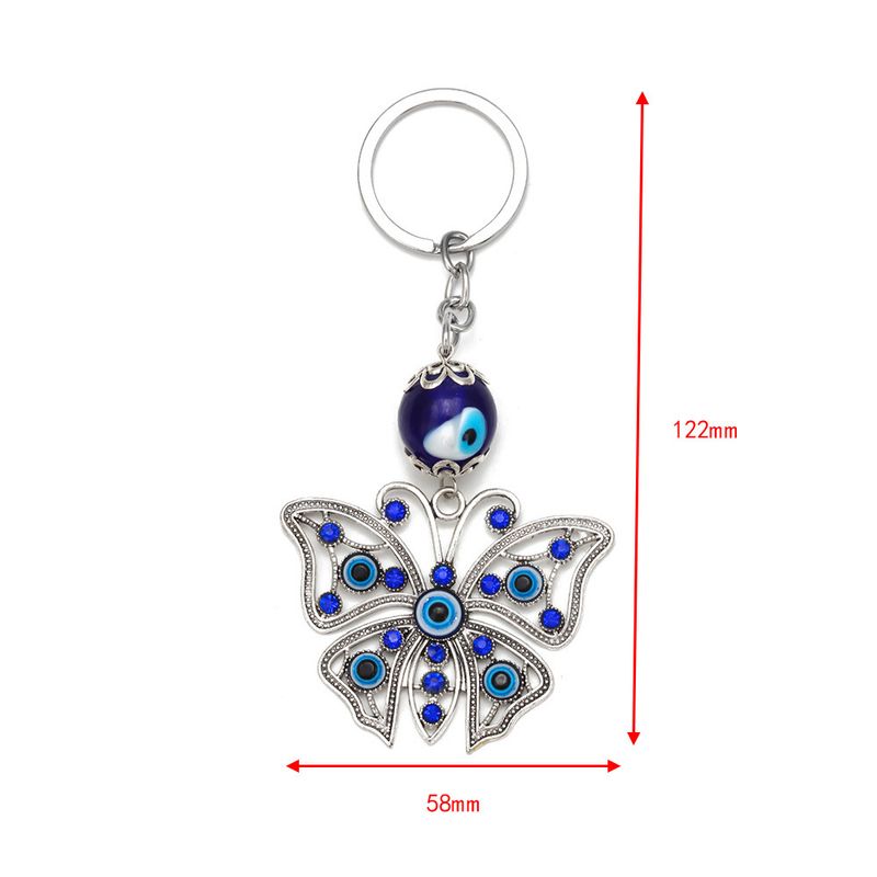 Portachiavi a forma di farfalla in lega con occhio del diavolo, da uomo e da donna, con fibbia per borsa tempestata di diamanti, accessorio da appendere all'auto_voghion.com