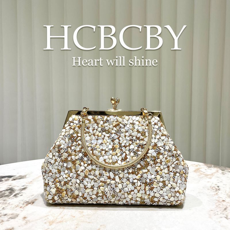 Borsa a mano decorata con conchiglia in pietra dorata, elegante e alla moda, da sera, da donna_voghion.com