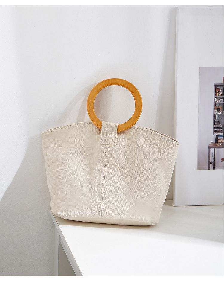 Borsa versatile e di grande capienza in versione coreana, la nuova borsa da donna minimalista in tela di quest'anno, manico in legno_voghion.com