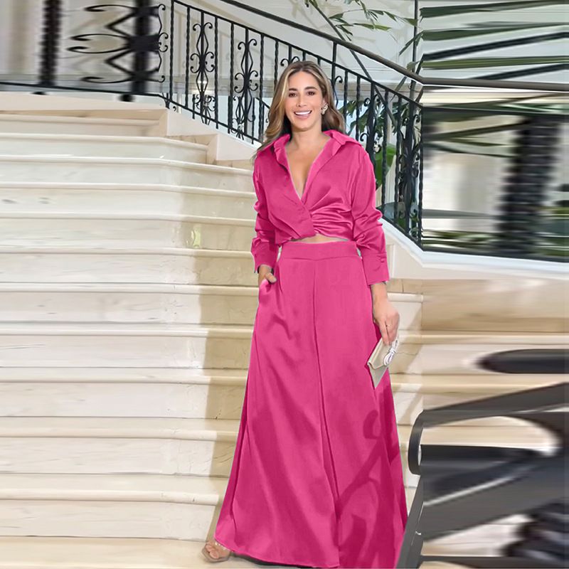 Completo da donna con camicetta e pantaloni con risvolto, elegante abbigliamento casual da ufficio, in poliestere elasticizzato e confortevole, camicia a maniche lunghe rosa con pantaloni coordinati_voghion.com