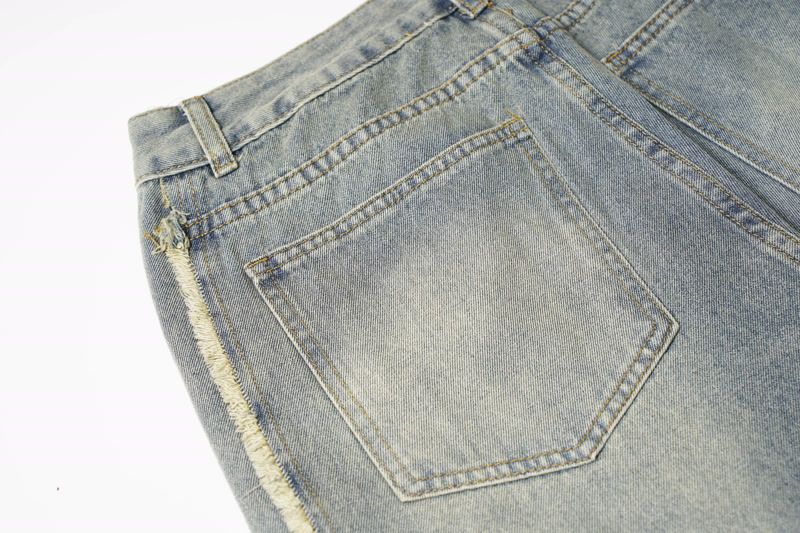 Muška odjeća Modni brend Krojenje Raw Edge Bar Design Isprane stare rupe Izlizane bijele široke nogavice High Street trend muške traperice_voghion.com
