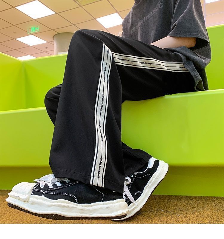 Ανδρικά ρούχα καθημερινά παντελόνια με ρίγες στο πλάι Ανδρικά νέα μοντέρνα παντελόνια φαρδιά πεσμένα παντελόνια High Street Straight σφουγγαρίστρα Αθλητικά παντελόνια_voghion.com