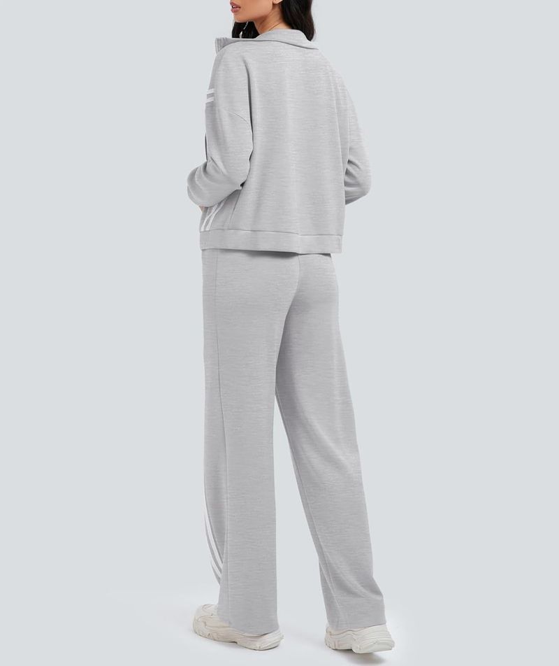 Completo da salotto elegante da donna in due pezzi: tuta con zip e strisce a contrasto e pantaloni jogger a gamba larga per viaggi e allenamento_voghion.com
