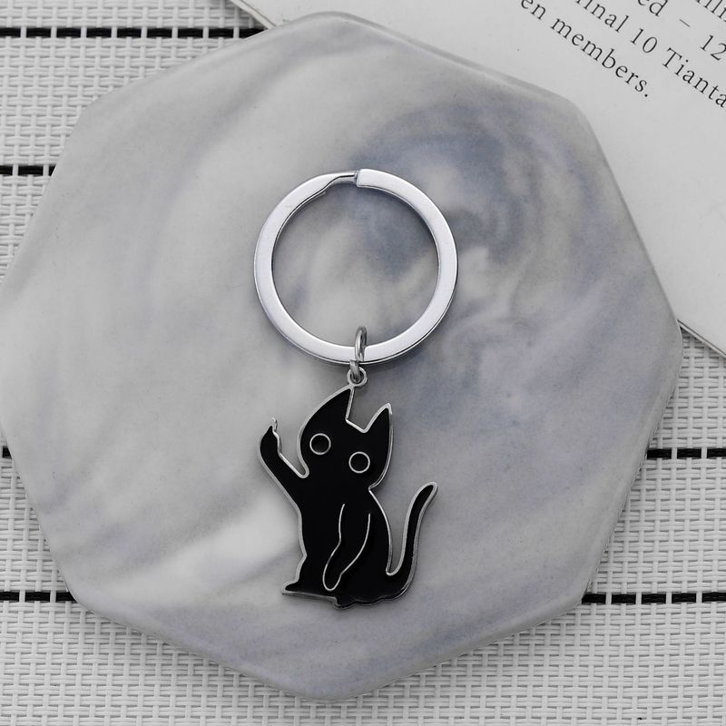 Portachiavi a forma di gattino scontento, divertente, in acciaio inossidabile, con ciondolo a forma di gatto nero con dito medio verticale._voghion.com