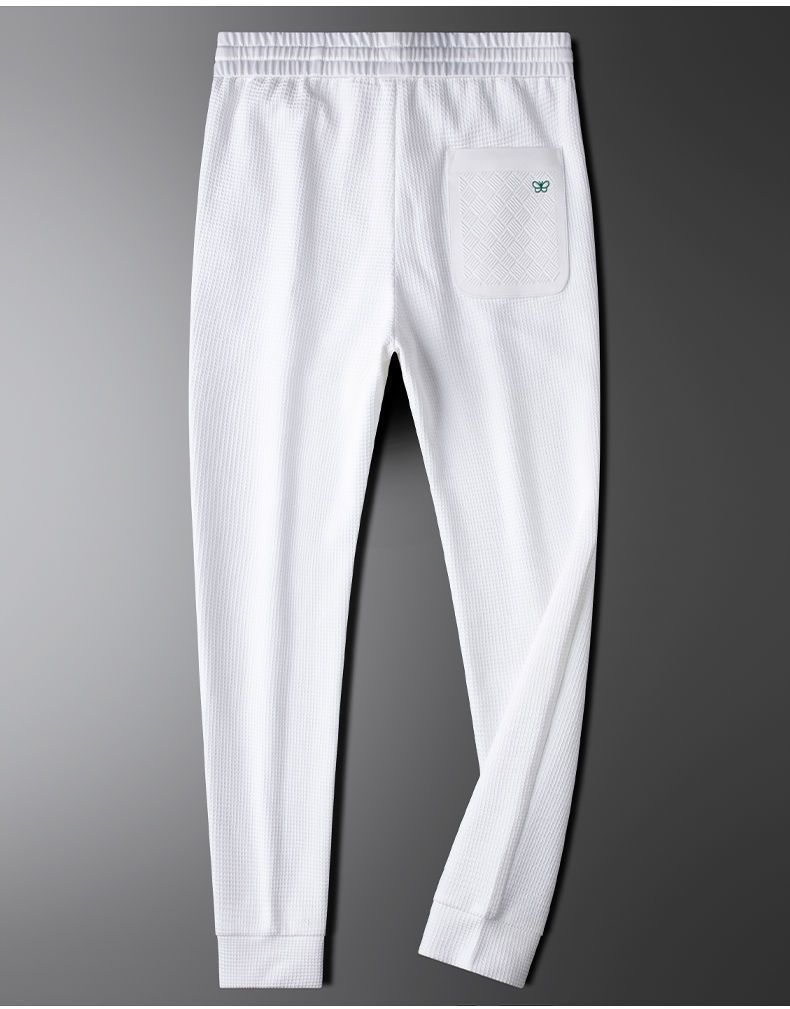 Pantaloni bianchi a quadri waffle leggeri di lusso alla moda europea per uomo, vestibilità slim e casual morbidi, primavera e autunno_voghion.com