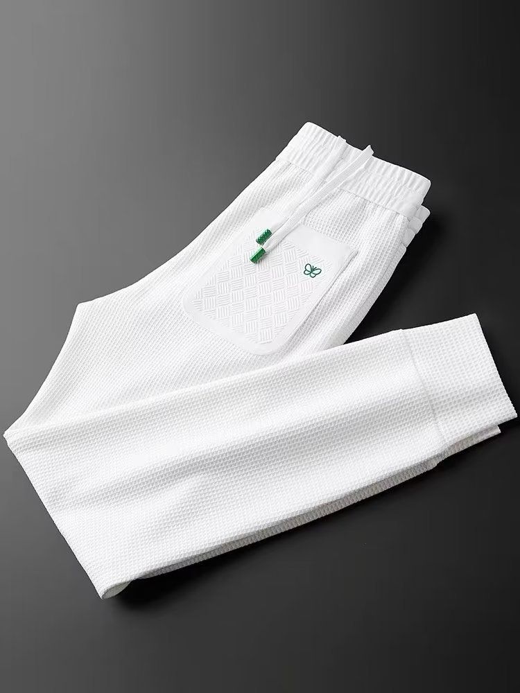 Pantalones casuales de punto gofre con diseño de mariposa para hombre - Joggers ajustados con puños elásticos para primavera y otoño - Pantalones deportivos ligeros y transpirables_voghion.com