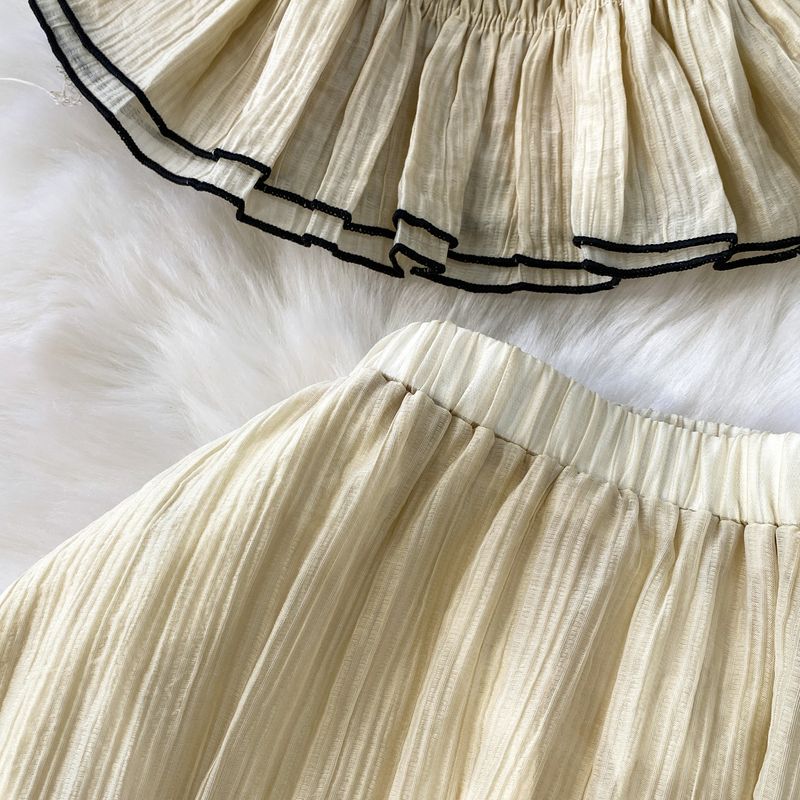 Completo due pezzi da donna con top snellente con spalline scoperte e vita elasticizzata a pieghe + gonna a balze a vita alta_voghion.com