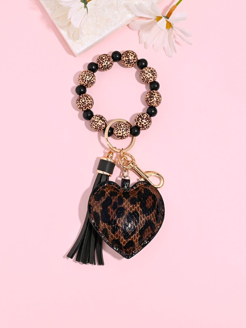 Portachiavi con braccialetto di perline di legno color leopardo, portachiavi con nappa a forma di cuore in pelle alla moda_voghion.com