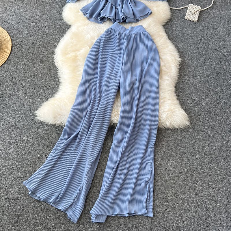 Vêtements pour femmes Costume de vacances pour femmes 2023 nouvelle chemise en mousseline de soie à bretelles à épaules dénudées à volants et pantalon large plissé drapé_voghion.com