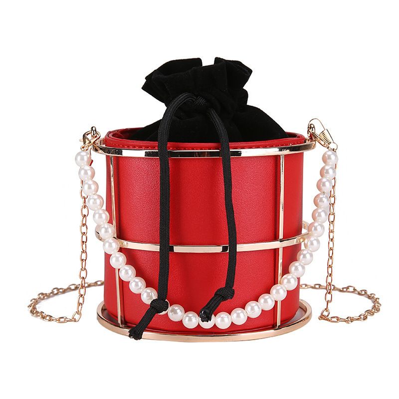 Articolo caldo Iron Art Hollow Drawstring Bucket New Ins Trend Pearl Handheld Chain Elegante borsa a tracolla_voghion.com