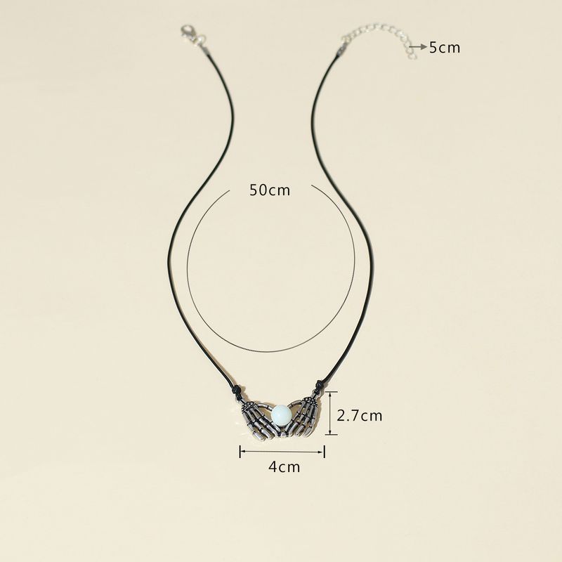Serie di gioielli di Halloween con teschi: collana di perline luminose a forma di mano punk con scheletro a forma di cuore, regali di Halloween esagerati creativi e personalizzati_voghion.com