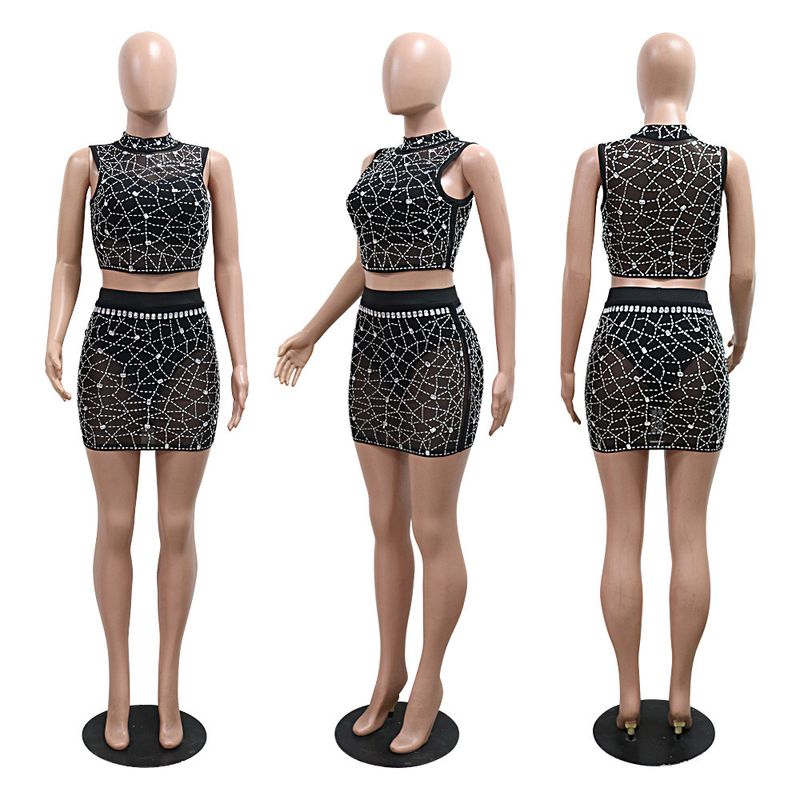 Completo due pezzi in rete con paillettes - Top corto con scollo tondo e minigonna aderente con lingerie_voghion.com