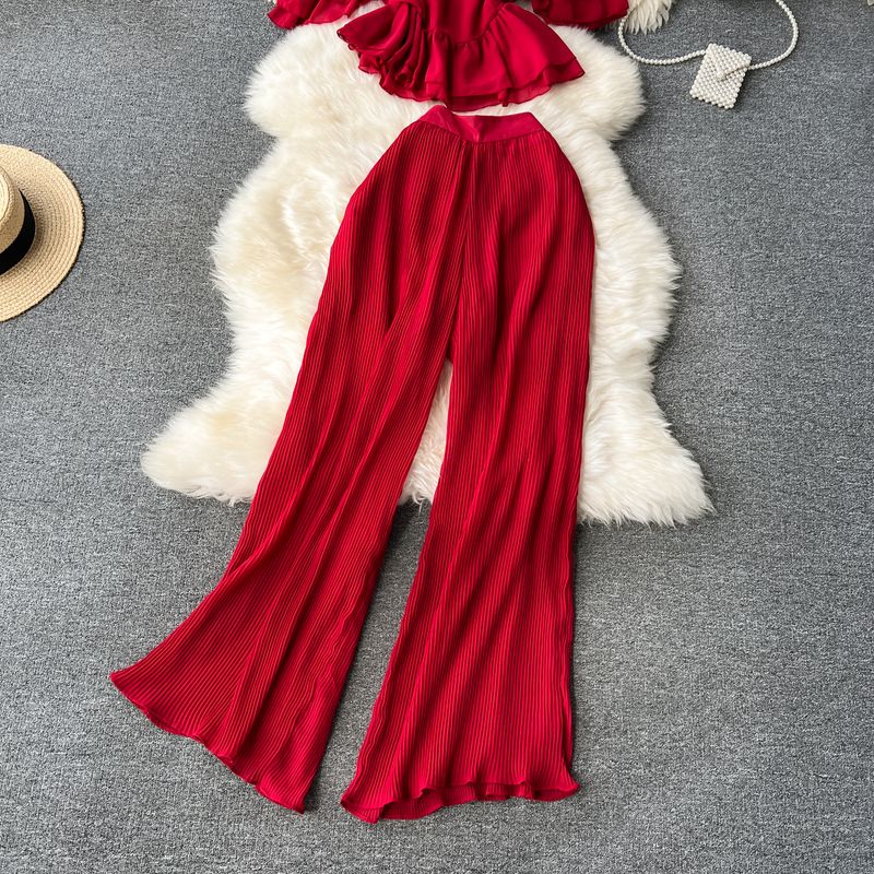 Vêtements pour femmes Costume de vacances pour femmes 2023 nouvelle chemise en mousseline de soie à bretelles à épaules dénudées à volants et pantalon large plissé drapé_voghion.com