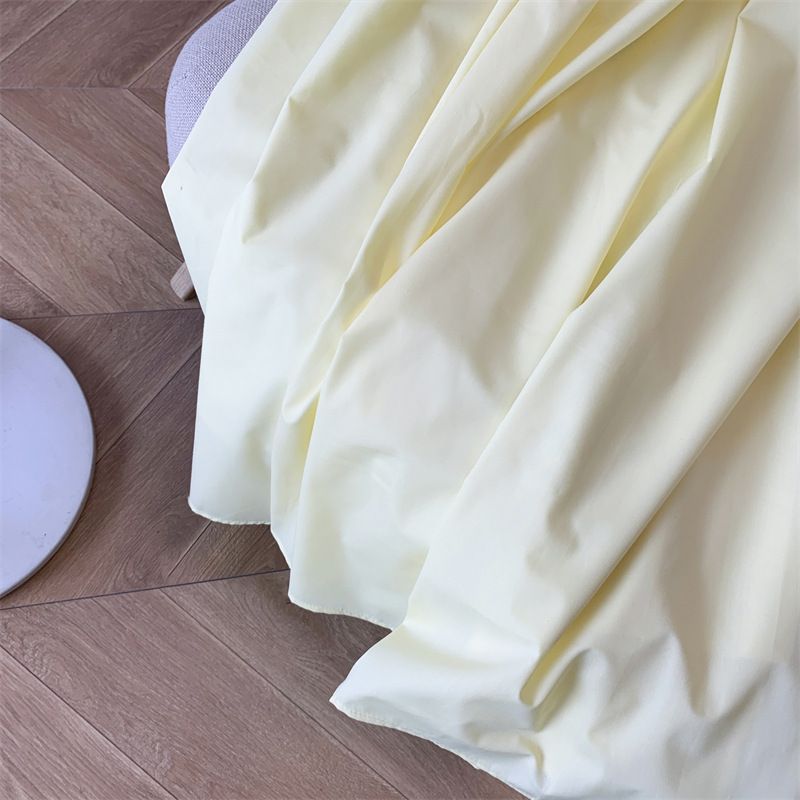 Gonna gialla da donna, a vita alta, a trapezio, sottile, di media lunghezza, con grande gonna a ombrello._voghion.com