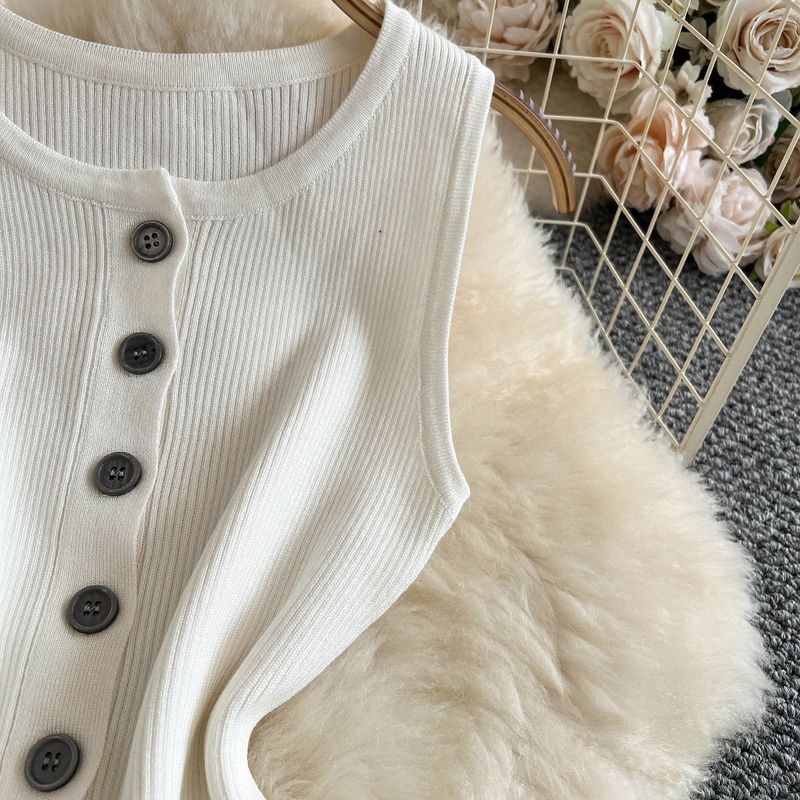 Abito da donna in maglia retrò, senza maniche, con scollo rotondo, vestibilità attillata, monopetto, gonna aderente con cintura sui fianchi, lunghezza media_voghion.com