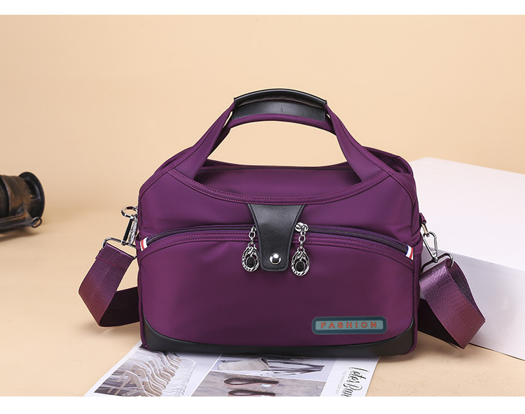 Modern och lätt Oxfordtyg Koreansk version Dam Casual Stor Kapacitet Vattentät Rese Shopping Handhållen Axelväska Crossbody_voghion.com