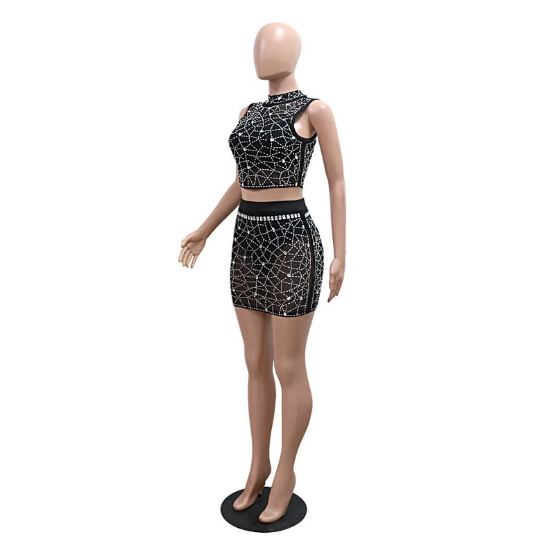 Completo due pezzi in rete con paillettes - Top corto con scollo tondo e minigonna aderente con lingerie_voghion.com
