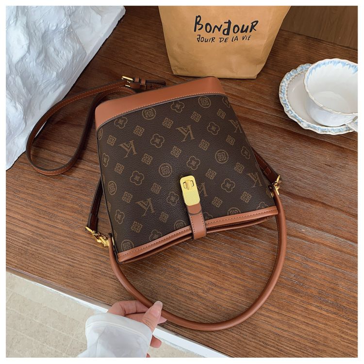 Tendenza di quest'anno: borsa a secchiello leggera e lussuosa stampata per le donne, nuova borsa alla moda 2025, borsa a tracolla versatile_voghion.com