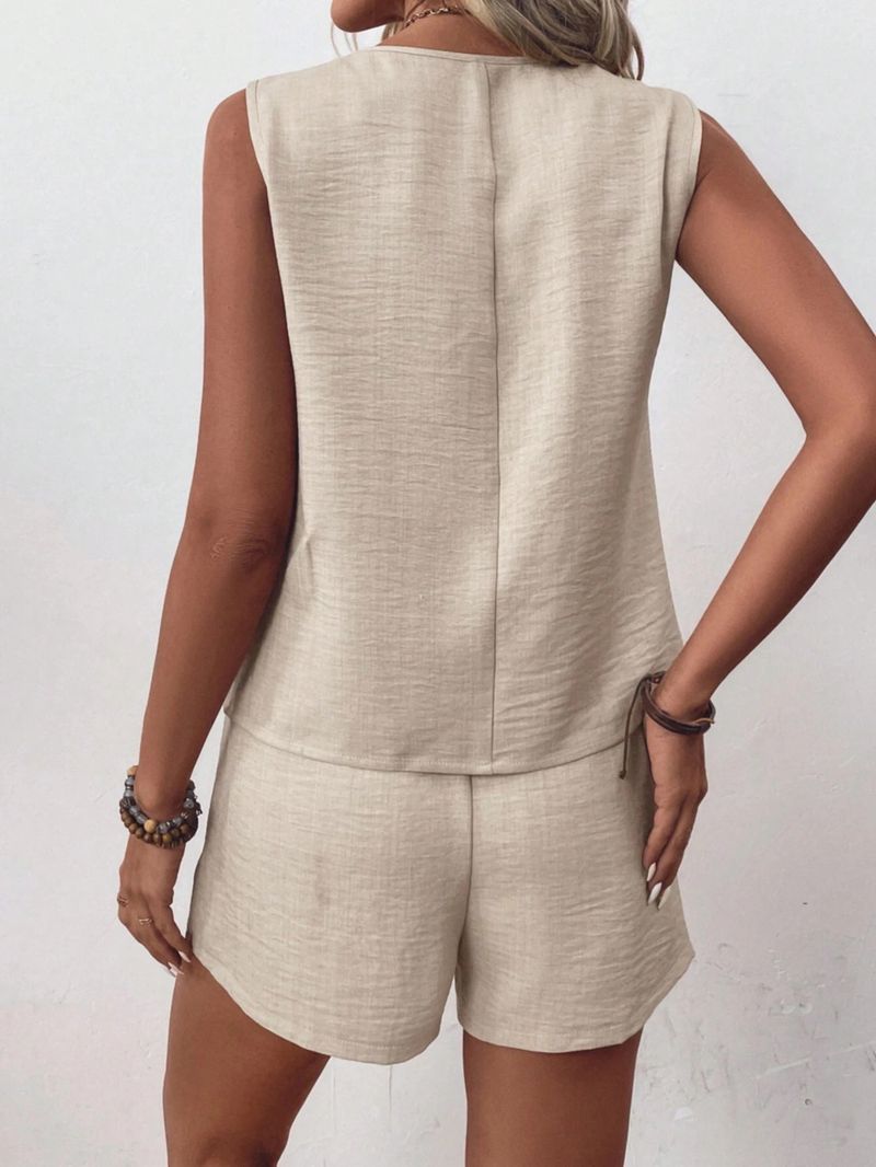 Completo estivo da donna, alla moda, casual, con scollo a V, gilet irregolare e pantaloncini._voghion.com