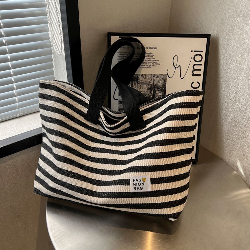 2024 nuova primavera/estate popolare borsa a tracolla semplice per pendolari borsa tote in tela portatile borsa casual di grande capacità per le donne_voghion.com