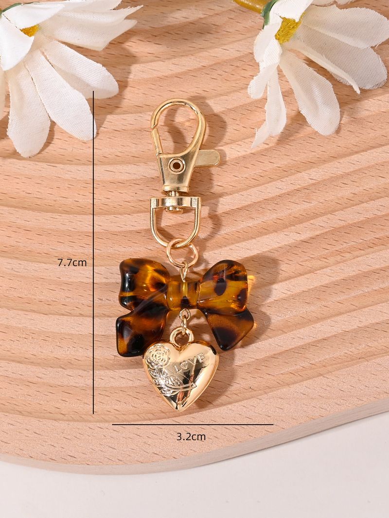 Porte-clés avec pompon et nœud papillon imprimé léopard, nouvelle mode, mignon, pendentif pour sac_voghion.com