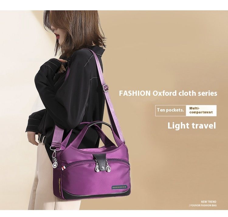 Modern och lätt Oxfordtyg Koreansk version Dam Casual Stor Kapacitet Vattentät Rese Shopping Handhållen Axelväska Crossbody_voghion.com