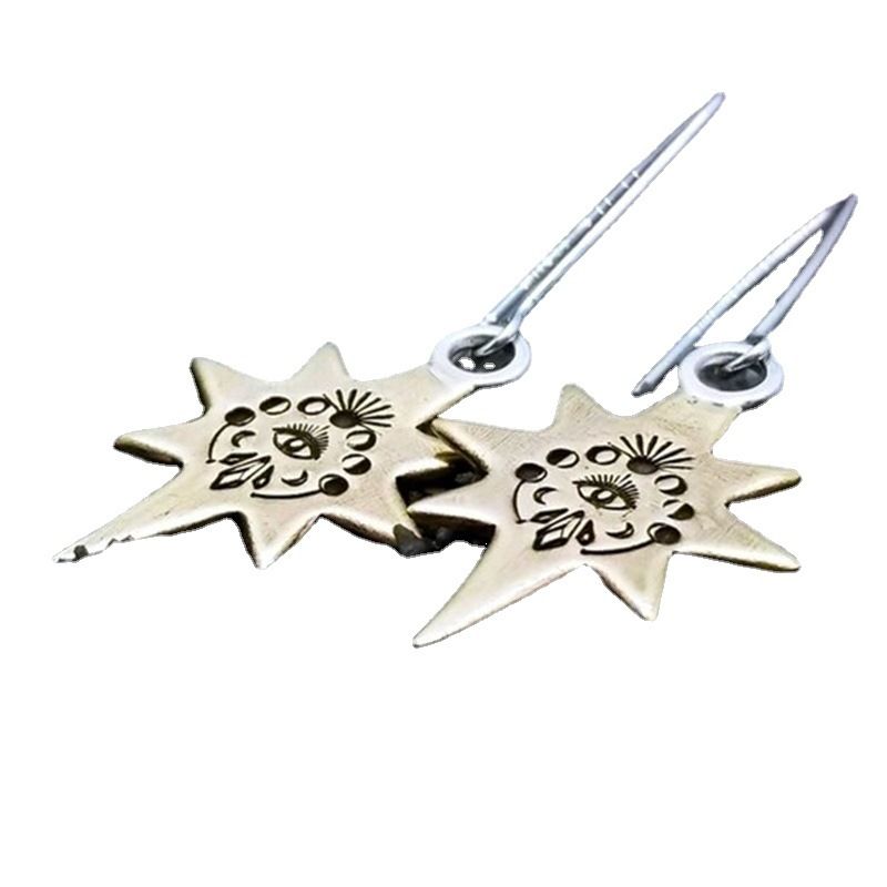 Orecchini etnici con stella a otto punte e occhi intagliati in metallo_voghion.com