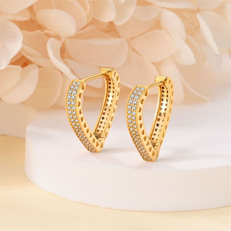 Orecchini da donna in argento placcato rame con zirconi a forma di cuore intarsiati in oro K_voghion.com