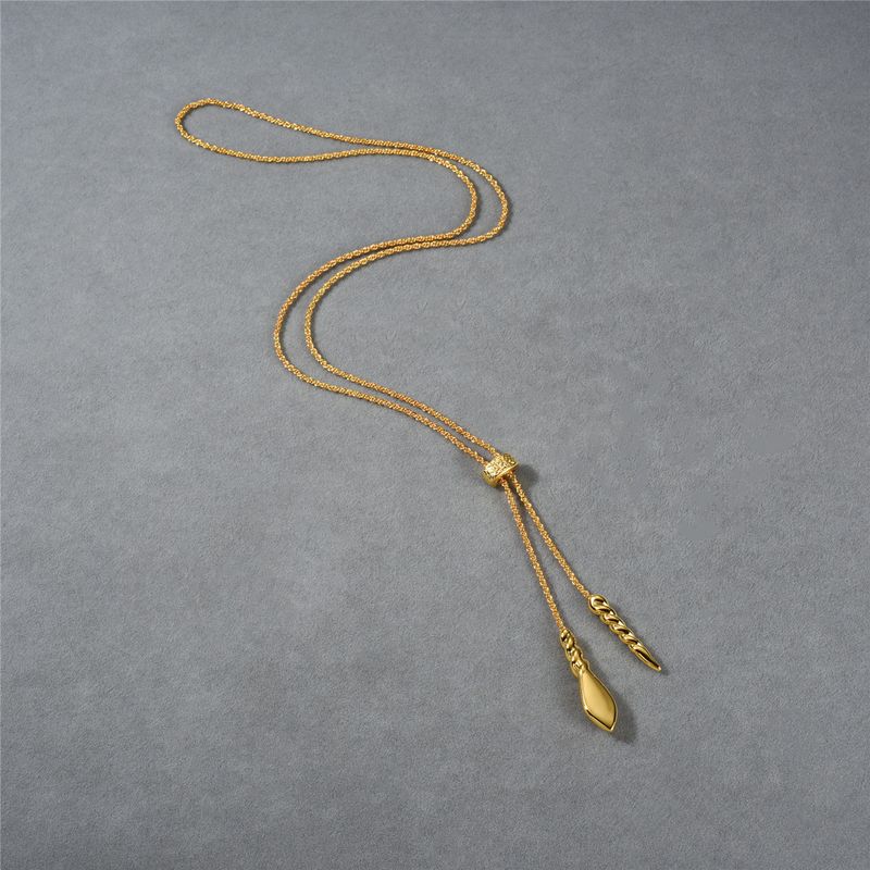 Collana con pendente a forma di testa di serpente a spirale lunga in oro alla moda per donna - Pezzo distintivo regolabile per outfit eleganti. Catena per maglione per donna_voghion.com