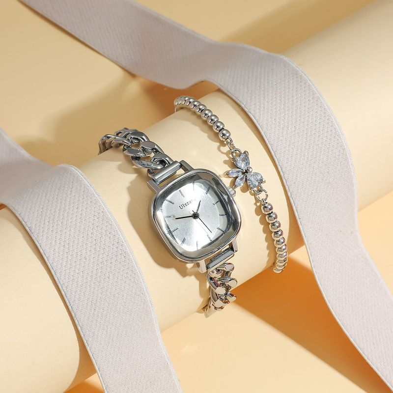 Dameur og smykkesæt med lilla Aurora-urskive og firkantet armbåndsur + armbåndssæt med sommerfuglesten til studerende_voghion.com